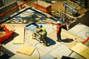 essential in construction, 2 workers working on site